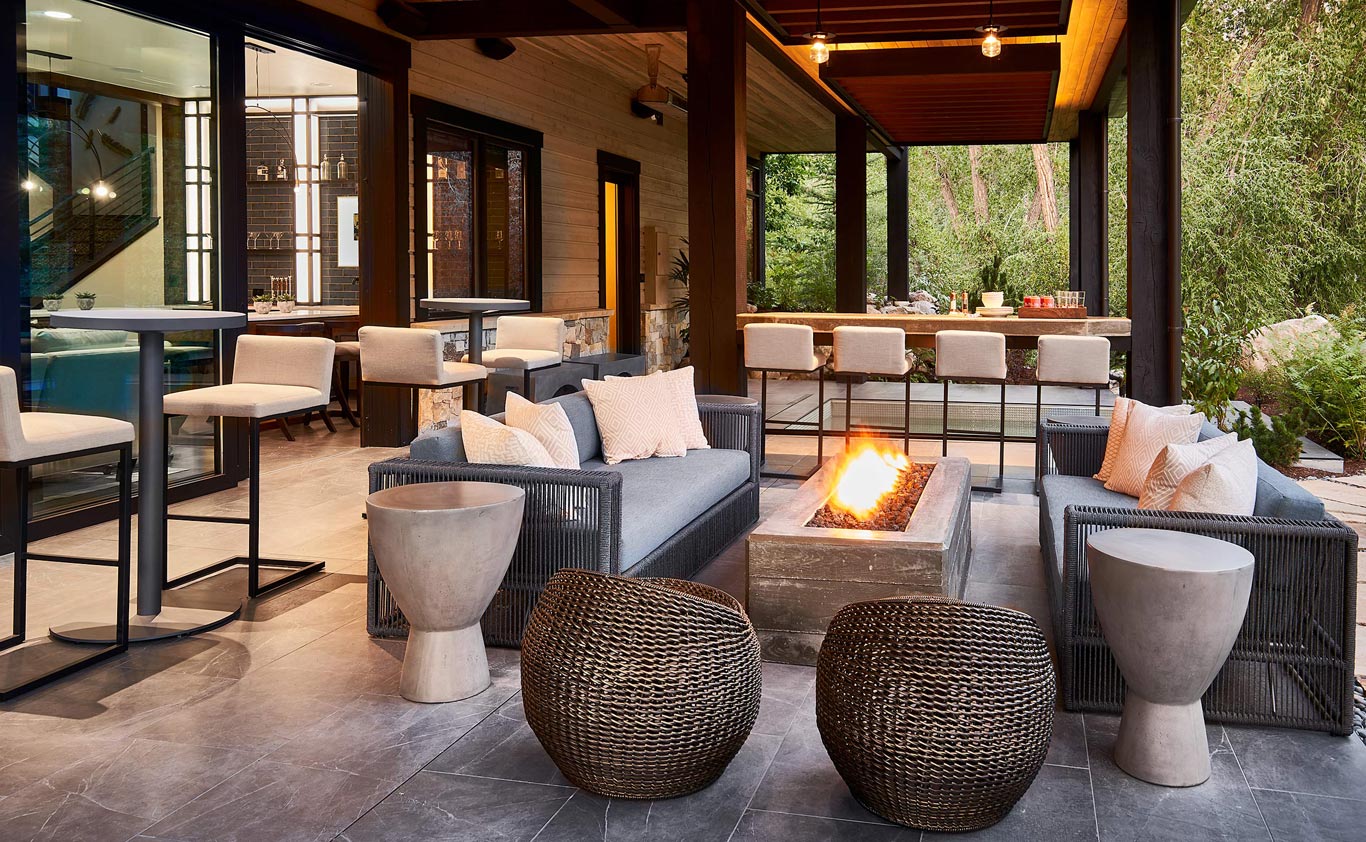 indoor outdoor seating area with seating and fire pit